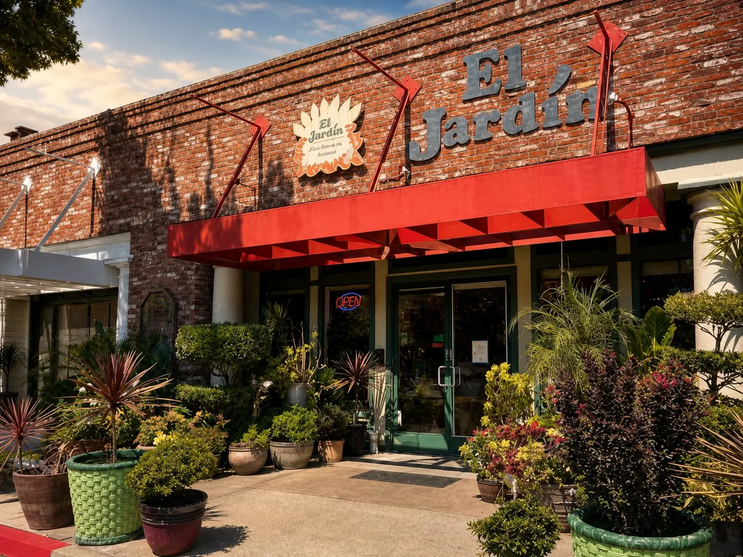 El Jardín's brick storefront and red awning on S Sierra Avenue in Oakdale